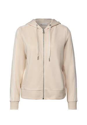 Beige zip-up hoodie with white stripes on sleeves, drawstrings on hood, ribbed cuffs, and side pockets.