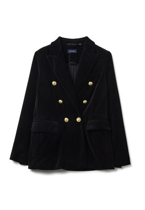 Blazer en velours noir à double boutonnage avec des accents de boutons dorés, revers crantés et deux poches avant. Texture lisse, coupe ajustée.