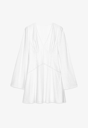 White long-sleeve blouse with a V-neck, gathered detailing at shoulders, lace trim accents, and a loose fit, made from lightweight fabric.