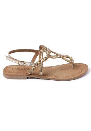 Sandalia plana en color marrón con diseño de tira entre los dedos, adornada con cuentas decorativas doradas y plateadas, que cuenta con un strap de tobillo con hebilla y una suela suave.