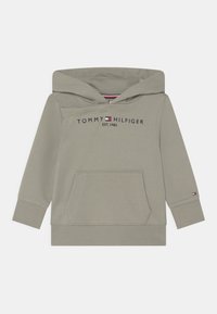 Felpa con cappuccio grigia chiara, dotata di tasca a marsupio, polsini e orlo a coste. "Tommy Hilfiger EST. 1985" stampato sul petto.