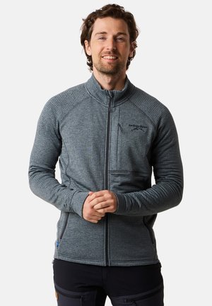 Graue Zip-Jacke aus strukturiertem Stoff, mit hohem Kragen und einer Fronttasche. Nahtdetails an Ärmeln und Seiten.