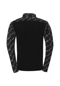 Langsleeve shirt met een effen zwarte body en mouwen met een zwart-grijs patroon. Gemaakt van zacht materiaal met een kraag.