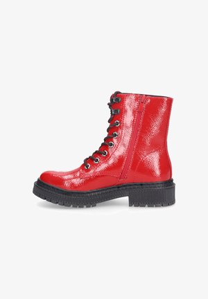 Red patent leather ankle boots with a chunky black sole, featuring black eyelets, laces, and a side zipper for easy wear.