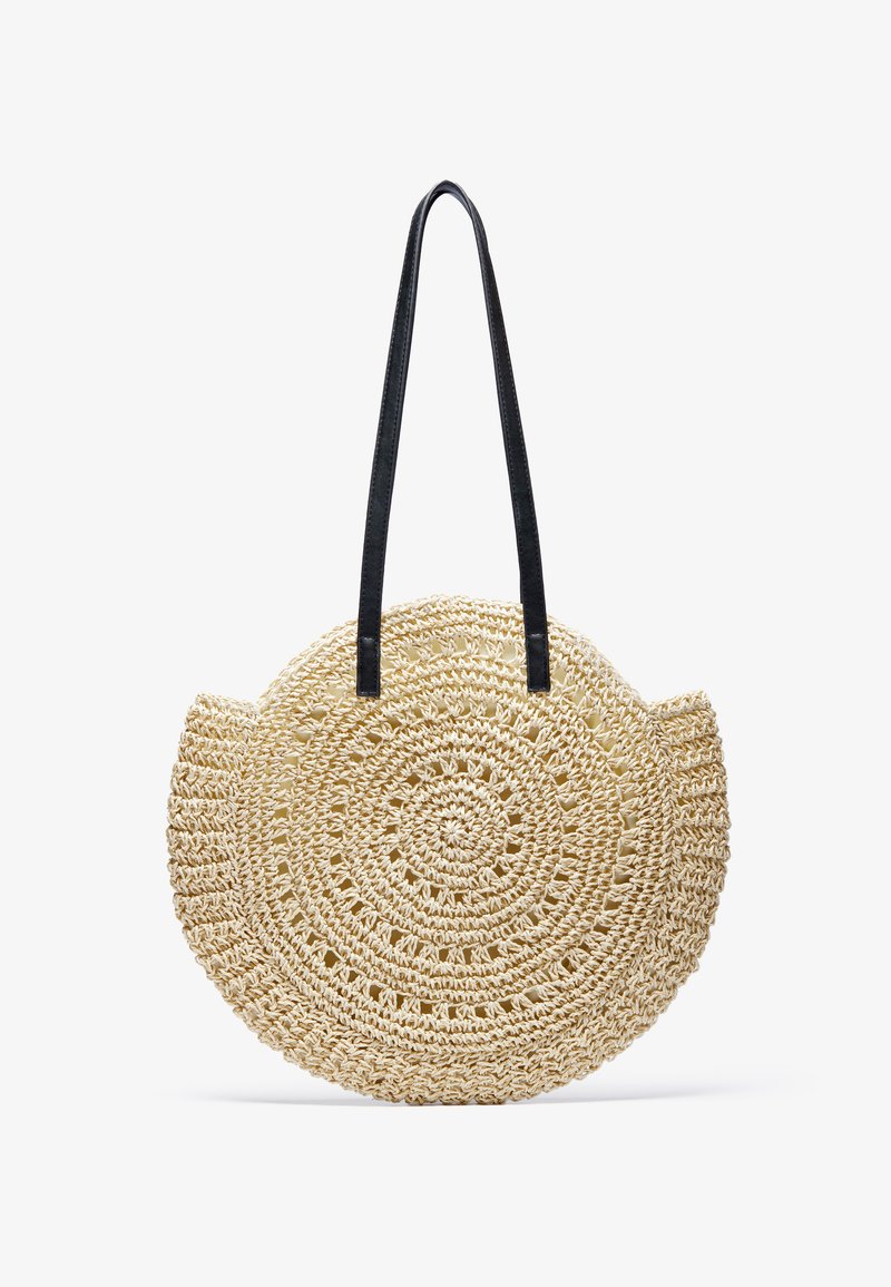 Bolsa de palha redonda com alças de pele preta, apresentando um design texturizado e tecido com padrões circulares e uma abertura no topo.