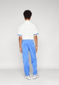 YOURTURN ADAPT RETRO JOGGER - Trainingsbroek - blue
