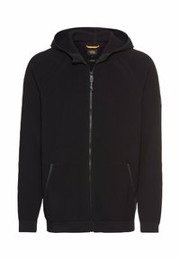 Marinefarbener Zip-Hoodie mit strukturiertem Strick, Raglanärmeln, zwei Fronttaschen und Kapuze. Enthält ein kontrastierendes Detail am inneren Kragen.