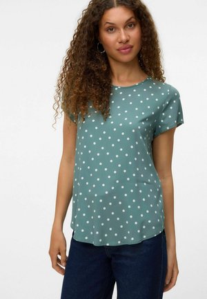 Kurze Ärmel Teal-Bluse mit weißen Punkten, aus glattem Stoff, mit rundem Ausschnitt und einem lockeren Schnitt.