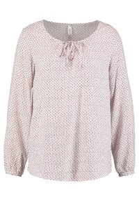 Leichte Bluse mit langen Ärmeln im rosa und weißen Blumenmuster. Sie hat einen Rundhalsausschnitt mit einer Krawatten-Detail und elastischen Bündchen.