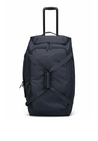 Sac de voyage de couleur marine avec une poignée télescopique, plusieurs poches zippées et des sangles croisées pour une fermeture sécurisée. Tissu durable avec une texture lisse.