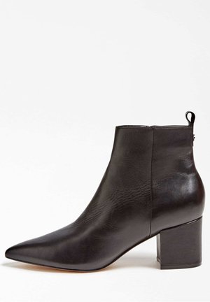 Black leather ankle boot with a pointed toe, block heel, side zipper, and pull tab at the back.