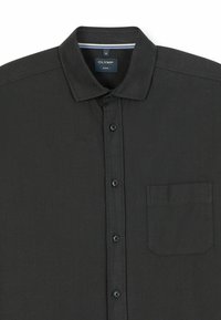 Black, herringbone-patterned button-up shirt with a collar. Features a patch pocket on the left side and dark buttons along the front.