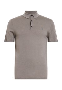 Kortärmad polo skjorta i ljusgrått, med krage i halsen, tre knappar fram och en subtil logga på bröstet. Mjuk textur.