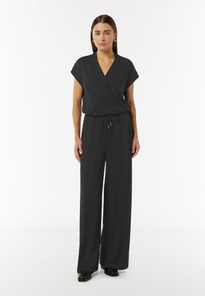 Black jumpsuit with short sleeves, V-neck, and cinched waist. The fabric has a subtle sheen, featuring wide, straight legs.