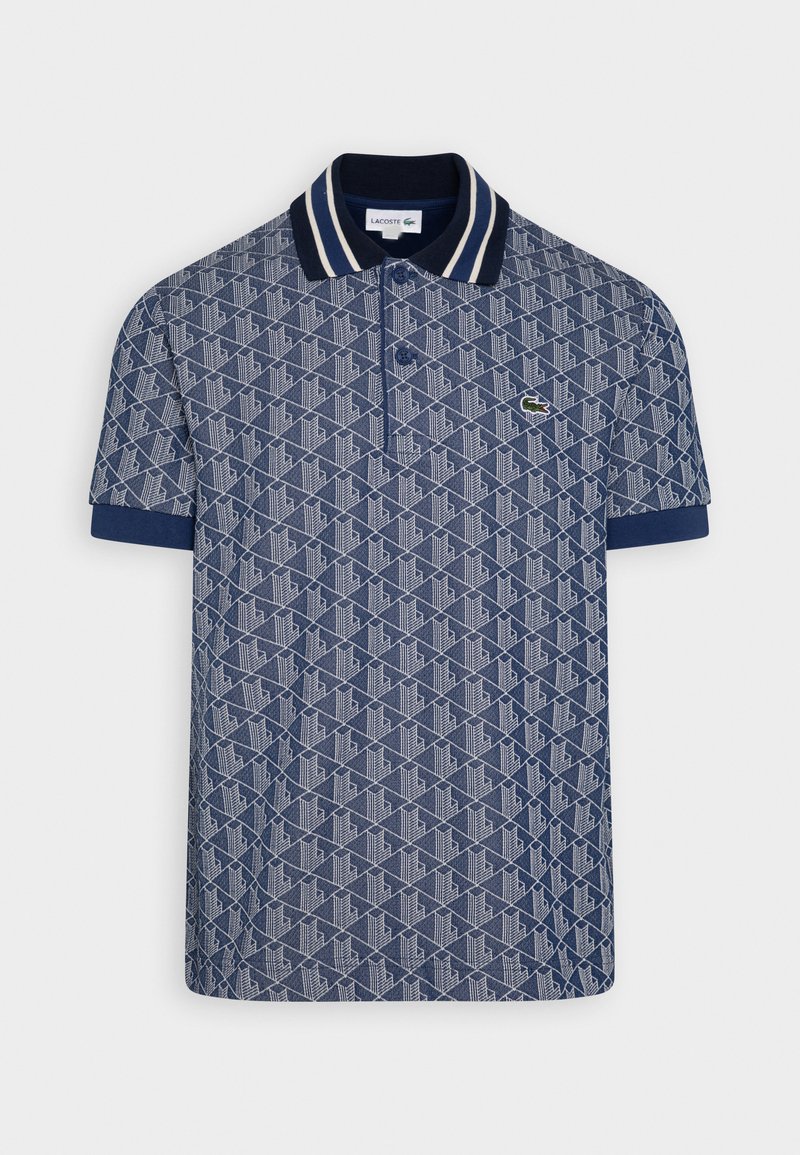 Marineblauw polo shirt met geometrisch patroon, witte en marineblauwe gestreepte kraag, korte mouwen en een klein groen logo op de borst.
