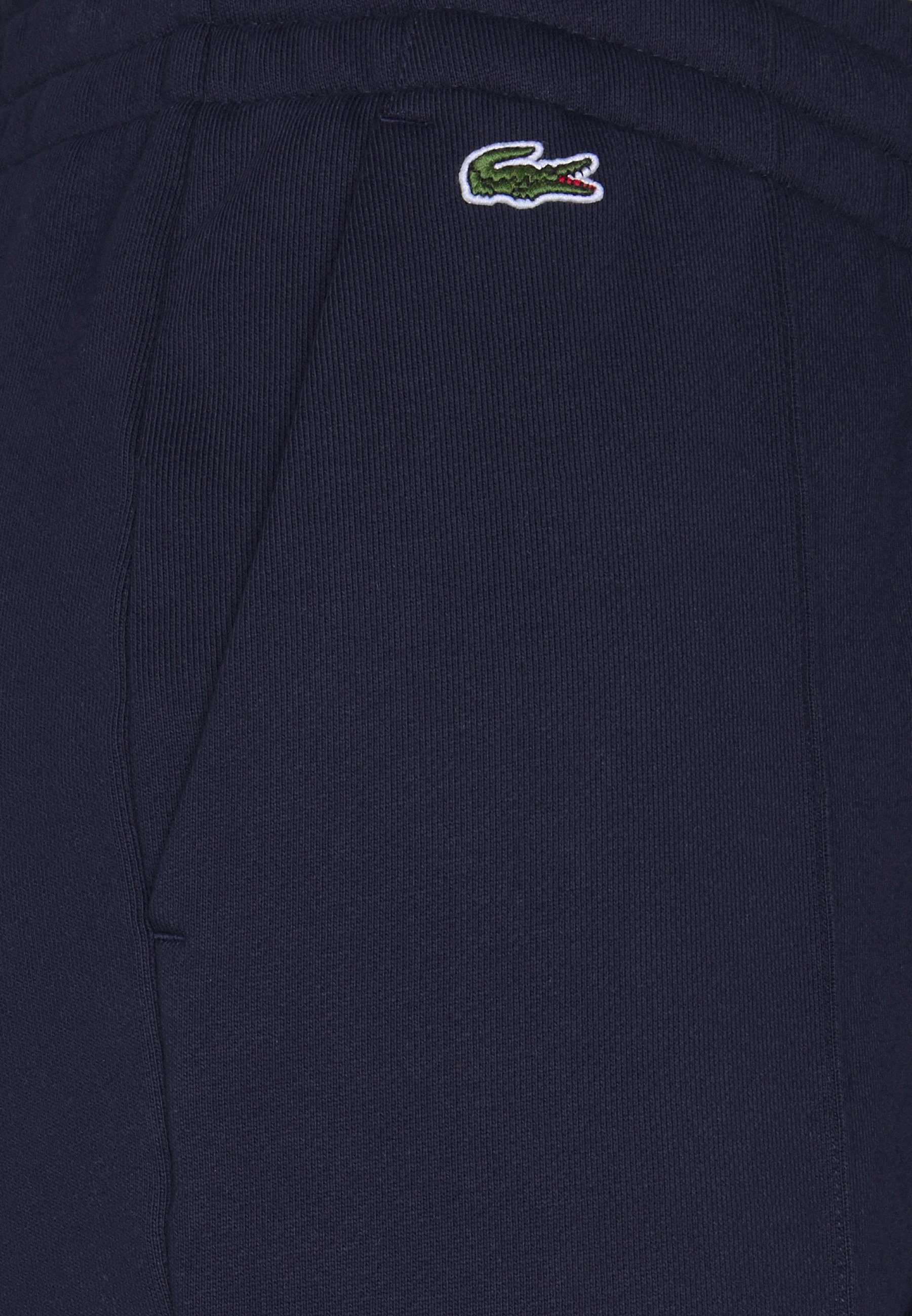 blue lacoste bottoms
