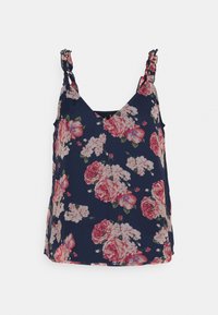 Top de tanque floral azul-marinho com alças em babado, apresentando grandes rosas cor-de-rosa e brancas em um tecido macio. Design em V com fendas laterais.