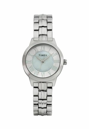 Ezüst Timex óra kerek, fényes tokjával, római számokkal, világoskék számlappal és fém láncos óraszíjjal.