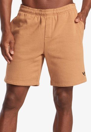 Men's tan sweat shorts with an elastic waistband, side pockets, and logo detail. Made from soft, textured fabric with a straight cut.