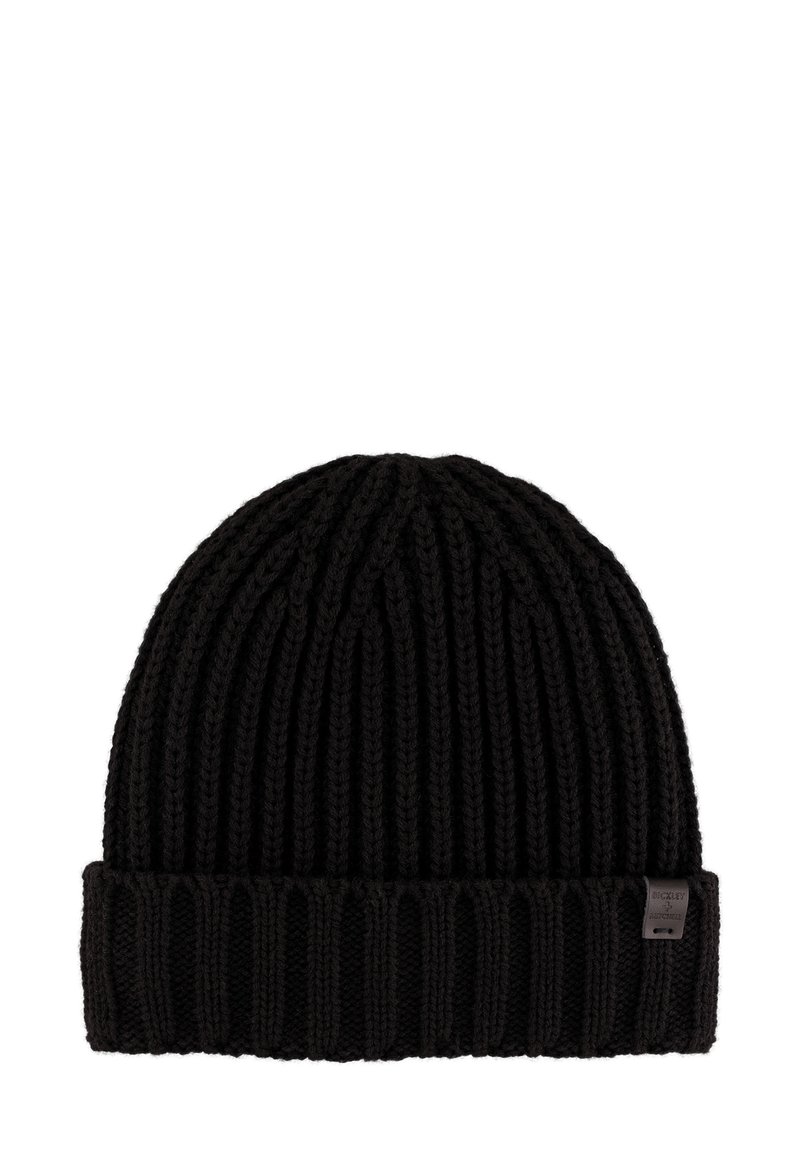 Black knitted beanie hat with a folded ribbed brim. Made of thick yarn, featuring a small logo tag on the side.