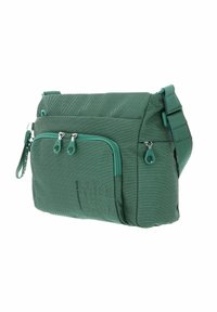 Sac messager vert en tissu texturé, poche avant zippée, sangle réglable et double curseur de fermeture éclair. Conception compacte avec détails cousus.