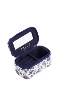 Floral-patterned jewelry box with a zip closure, navy blue fabric interior, and a small mirror on the inside lid. Features three compartments.