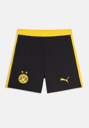 Black athletic shorts featuring yellow side stripes, a yellow Puma logo, and a yellow circular badge with "BVB 09" text and stars.