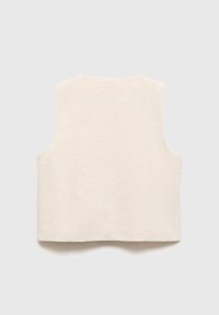 Top fără mâneci, de culoare bej deschis, realizat dintr-un material texturat, cu tiv neterminat și decolteu rotund. Design simplu, minimalist.