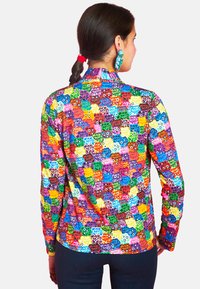 Long-sleeve shirt featuring a vibrant multicolored floral pattern with a smooth texture and fitted design. Back view shows collar detail.