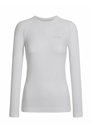 Top blanc à manches longues en matière élastique lisse avec une texture côtelée sur les côtés et un col rond ; présente un logo de marque subtil.