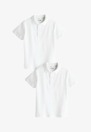Camisas polo cortas de manga blanca, fabricadas en algodón suave. Presentan un cuello clásico, una tapeta de tres botones y un diseño de hombros sin costuras.