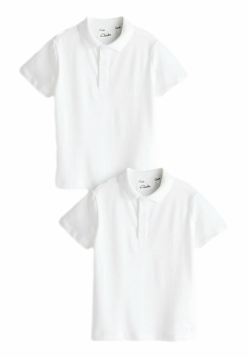 Polo shirts blancs à manches courtes en coton lisse. Dotés d'un col classique, d'une patte de boutonnage à trois boutons et d'une conception d'épaule sans couture.