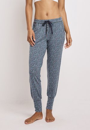 Blommiga pyjamasbyxor i mörk teal med dragsko i midjan. Har ett mönstrat tyg, elastiska mudd samt dekorativa knappar vid midjan.