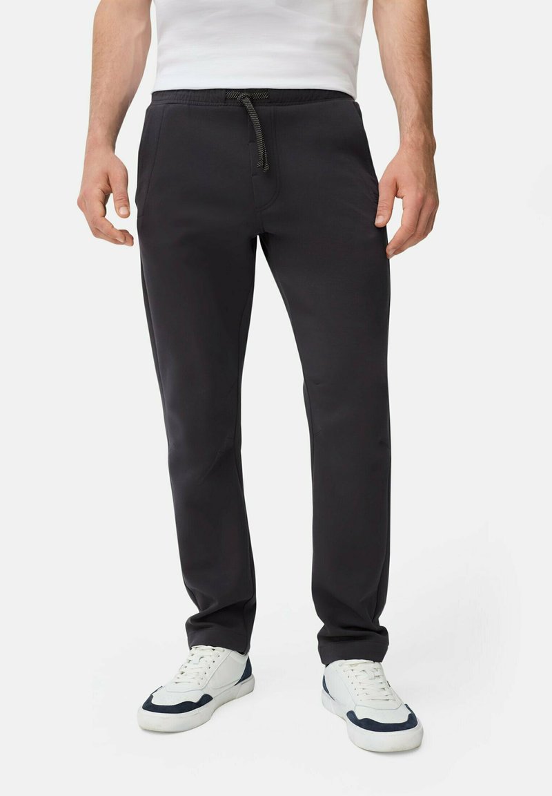 Grijze sweatpants met een elastische tailleband en koord, beschikken over zijzakken en een taps toelopend ontwerp, gemaakt van een zachte, ademende stof.
