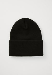 Bonnet en maille noire avec un revers, fabriqué en tissu doux. Présente une finition texturée et une forme de haut arrondie.