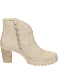 Beige ankelboot med lågskuren design, sidodragkedja, texturerad klack och mönstrad sula. Mjuk mockaliknande material med synlig sömnad.