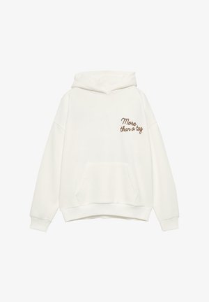 White hooded sweatshirt in soft fabric, featuring a front pocket and brown embroidered text "More than a tag" on the left chest.