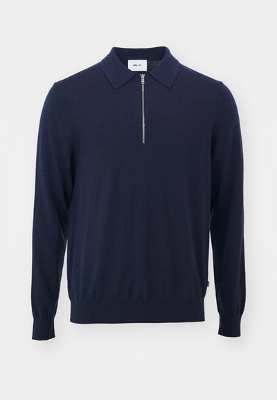 Dunkelblauer Strickpullover mit Kragen, verfügt über einen halben Reißverschluss und gerippte Bündchen, gefertigt aus weichem, glattem Material.