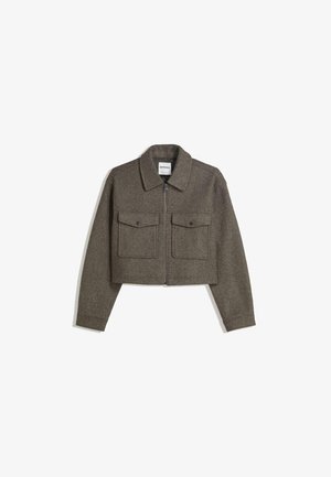 Cropped, olive green wool jacket with a collared neck, front zipper, and two chest pockets featuring snap closures. Smooth texture and tailored fit.