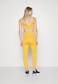 Girlfriend Collective COMPRESSIVE HIGH RISE - Tights - golden glow