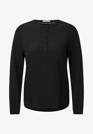 Haut noir à manches longues avec un col rond, tissu texturé, patte de boutonnage à l'avant et ourlet légèrement arrondi.