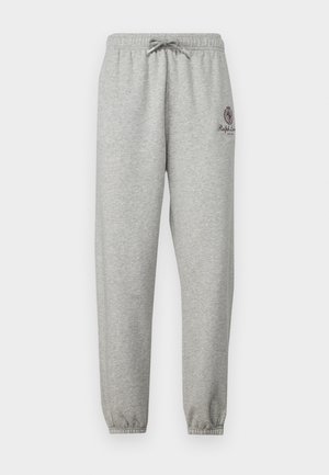 Pantaloni de jogging gri cu talie cu șnur, manșete elastice și detaliu logo pe partea stângă. Fabricat dintr-un material moale, texturat.