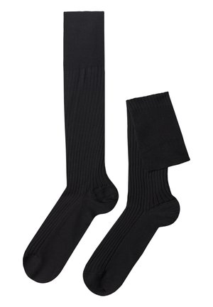 Sorte ribbede sokker med en glat tekstur, der har en høj rib og en kortere variant. Fremstillet af et fleksibelt og let materiale.