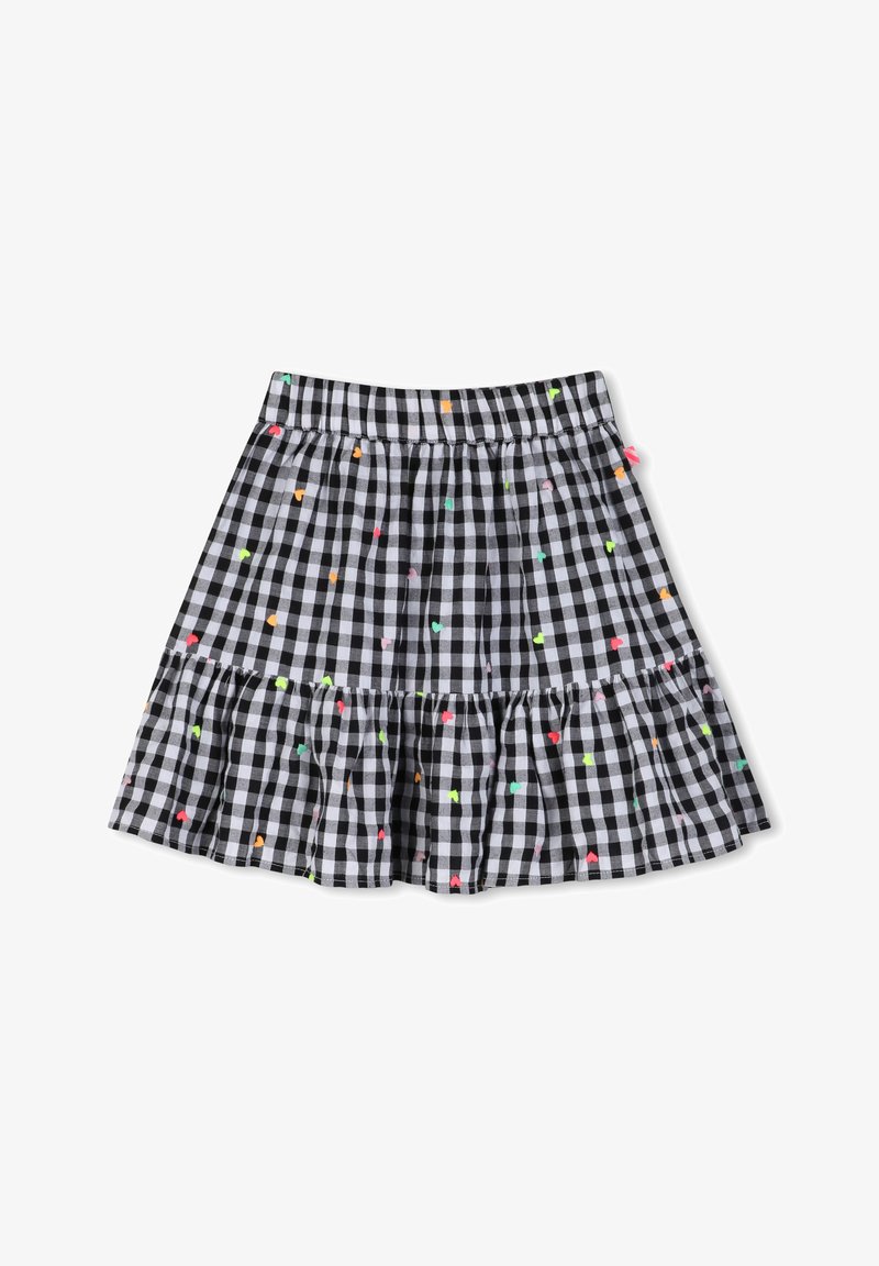 Jupe à carreaux noir et blanc avec un ourlet volanté et de petits motifs de cœurs multicolores dispersés sur le tissu.