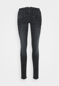 Svarta tajta jeans med blekta detaljer, framknäppning, bältesöglor och femficksdesign.