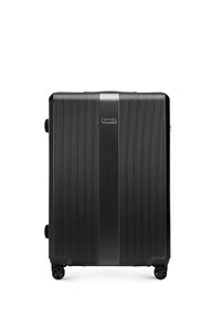 Black hard-shell suitcase with vertical ridges, central smooth stripe, four spinner wheels, and a "Wittchen" logo on front.