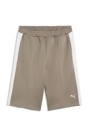 Béžové športové šortky s bielymi bočnými pruhmi, elastickým pásom a malým bielym logom Puma blízko dolného okraja na ľavej nohe.