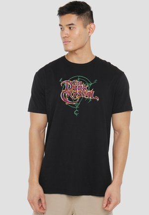 Black cotton t-shirt featuring colorful "The Dark Crystal" graphic print, round neckline, and short sleeves.