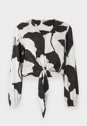 Black and white long-sleeve crop blouse with large floral pattern, button front, V-neck, and front tie knot.