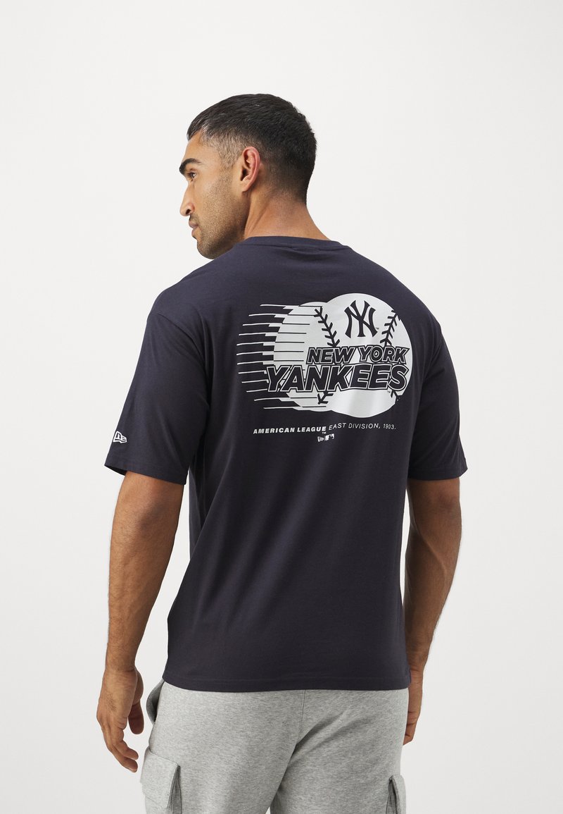 Navy cotton T-shirt featuring a large white "New York Yankees" graphic with a baseball design on the back. Short sleeves, relaxed fit.